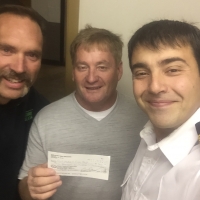 donation-to-Port-McNeill-fire-chief-Tasos-Baroutis